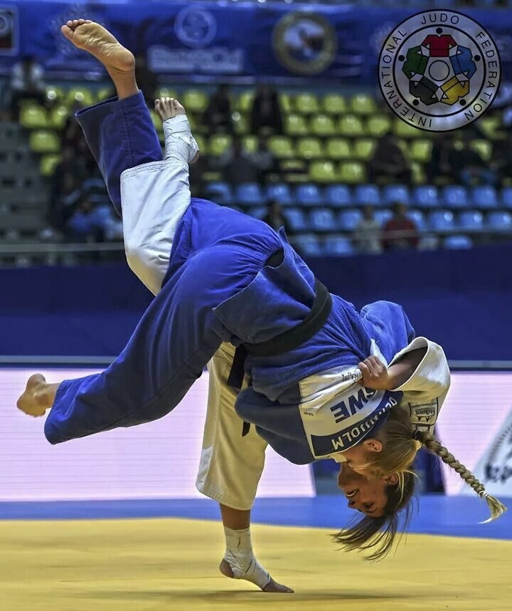 Two competitors executing a dynamic throw