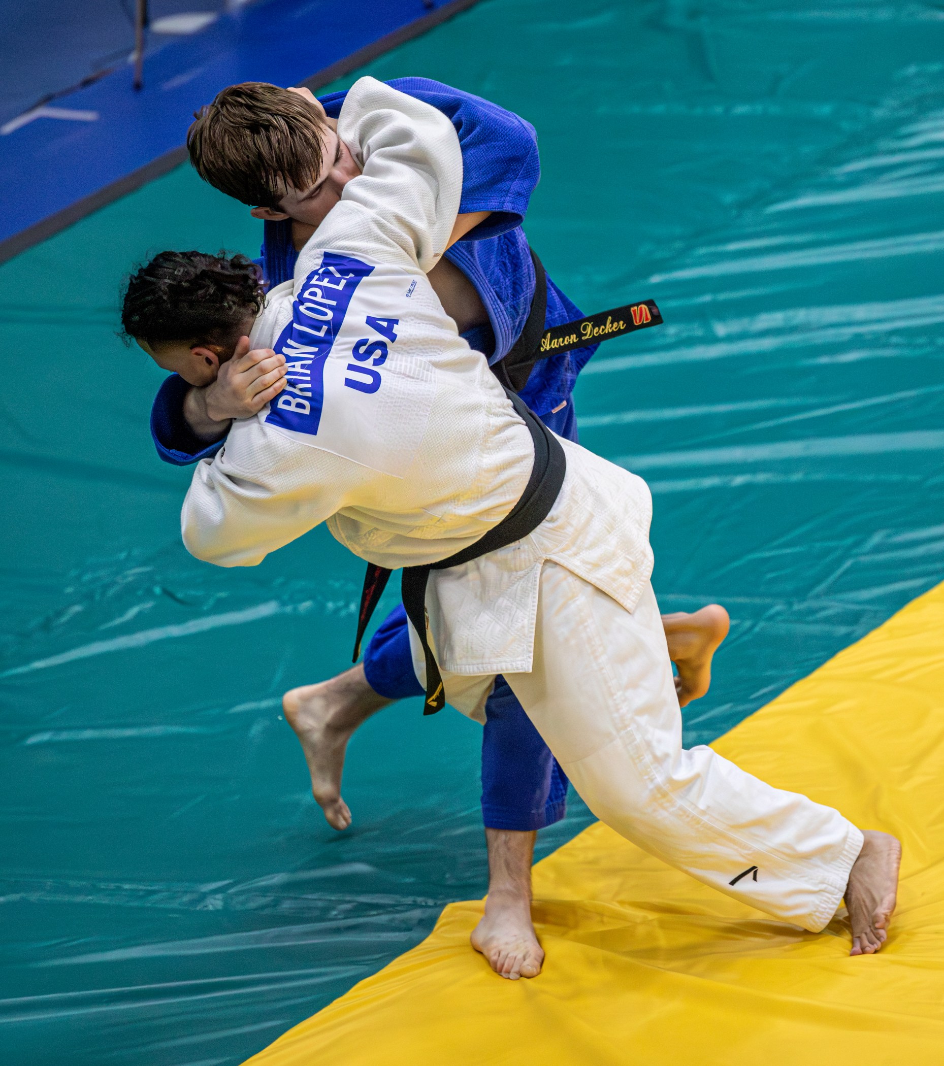 Two judoka in a standing throwing exchange